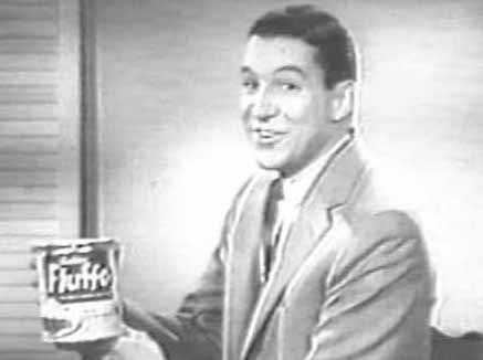 Mike Wallace holds can of Fluffo
