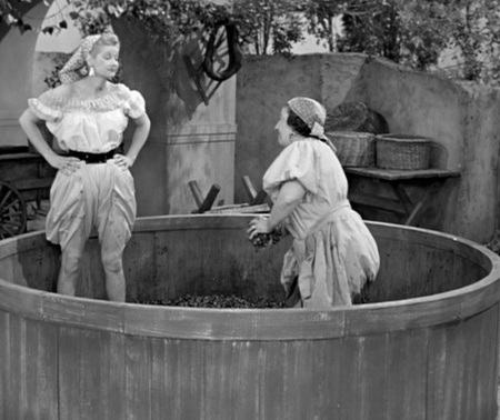 Lucy and Italian woman in grape vat