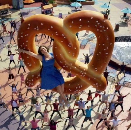 Rebecca rides a pretzel into the sky in Crazy Ex-Girlfriend